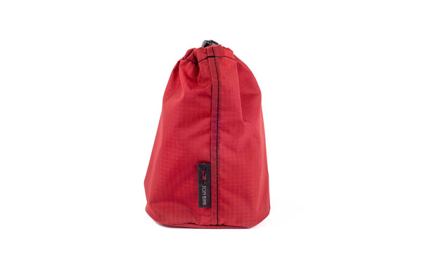 A Size 2 Sangria (red with light red grid) 210 Cerylon Travel Stuff Sack.